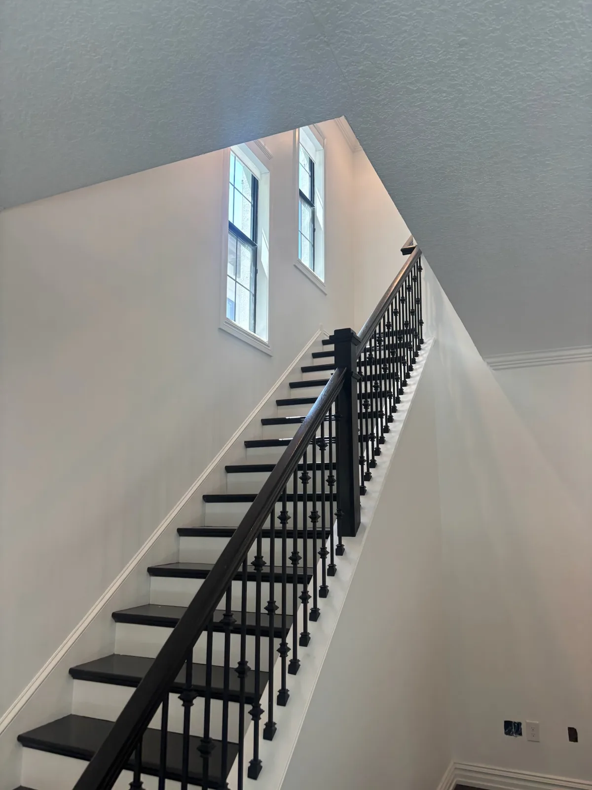 Interior stairway with finished trim and railing details